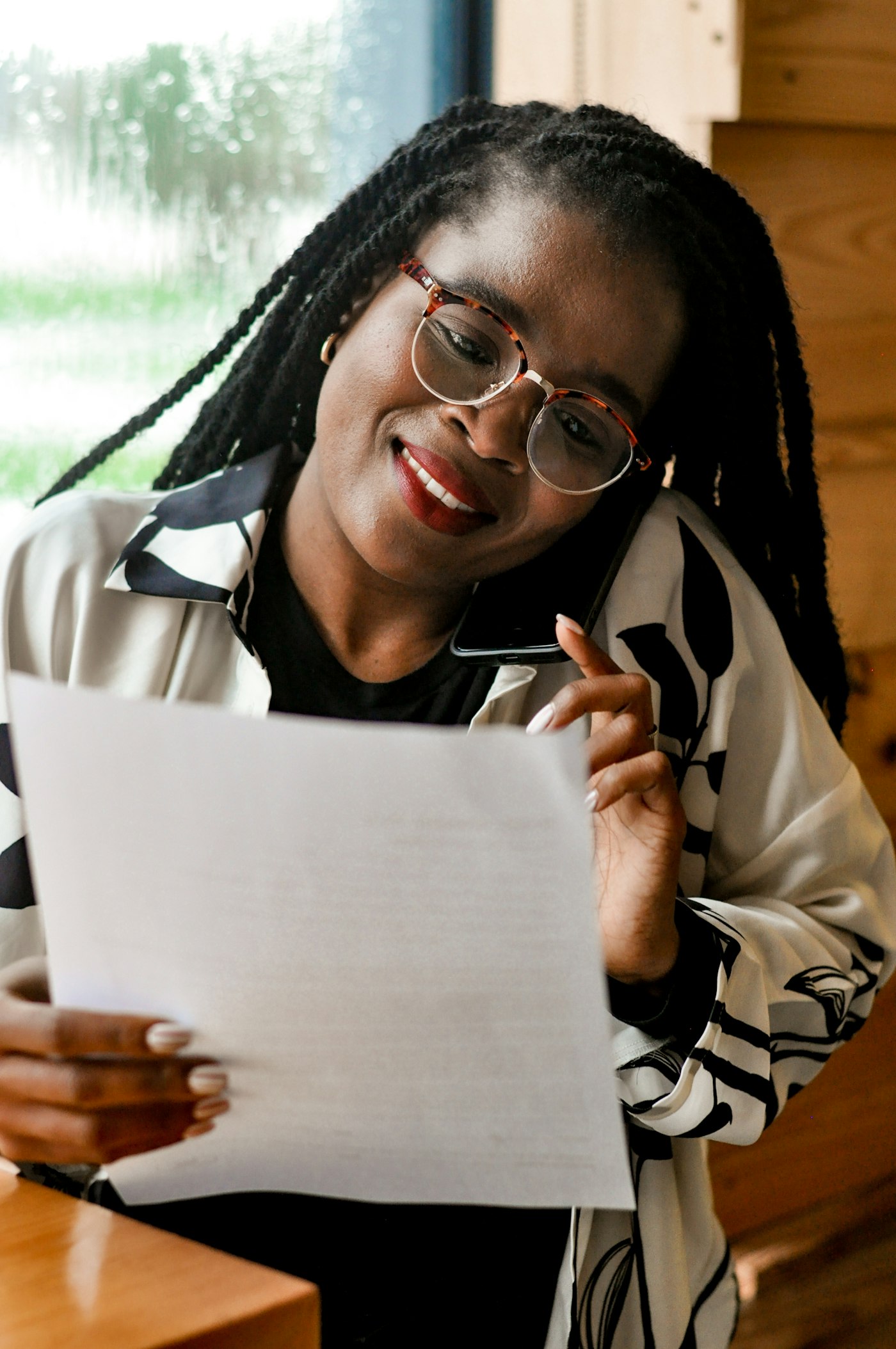 Author reviewing her manuscript pages